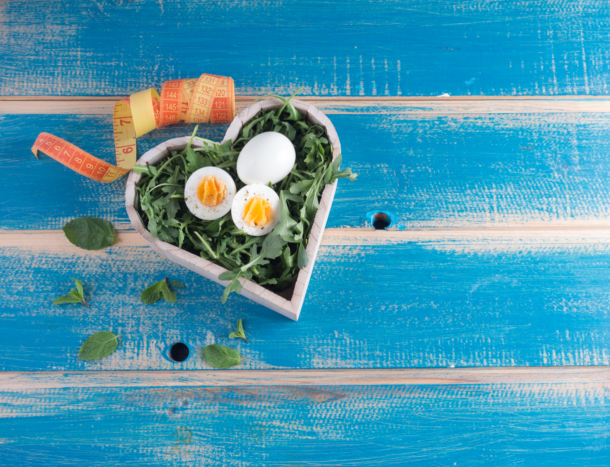 A colourful balanced meal with vegetables, grains and everyday table items